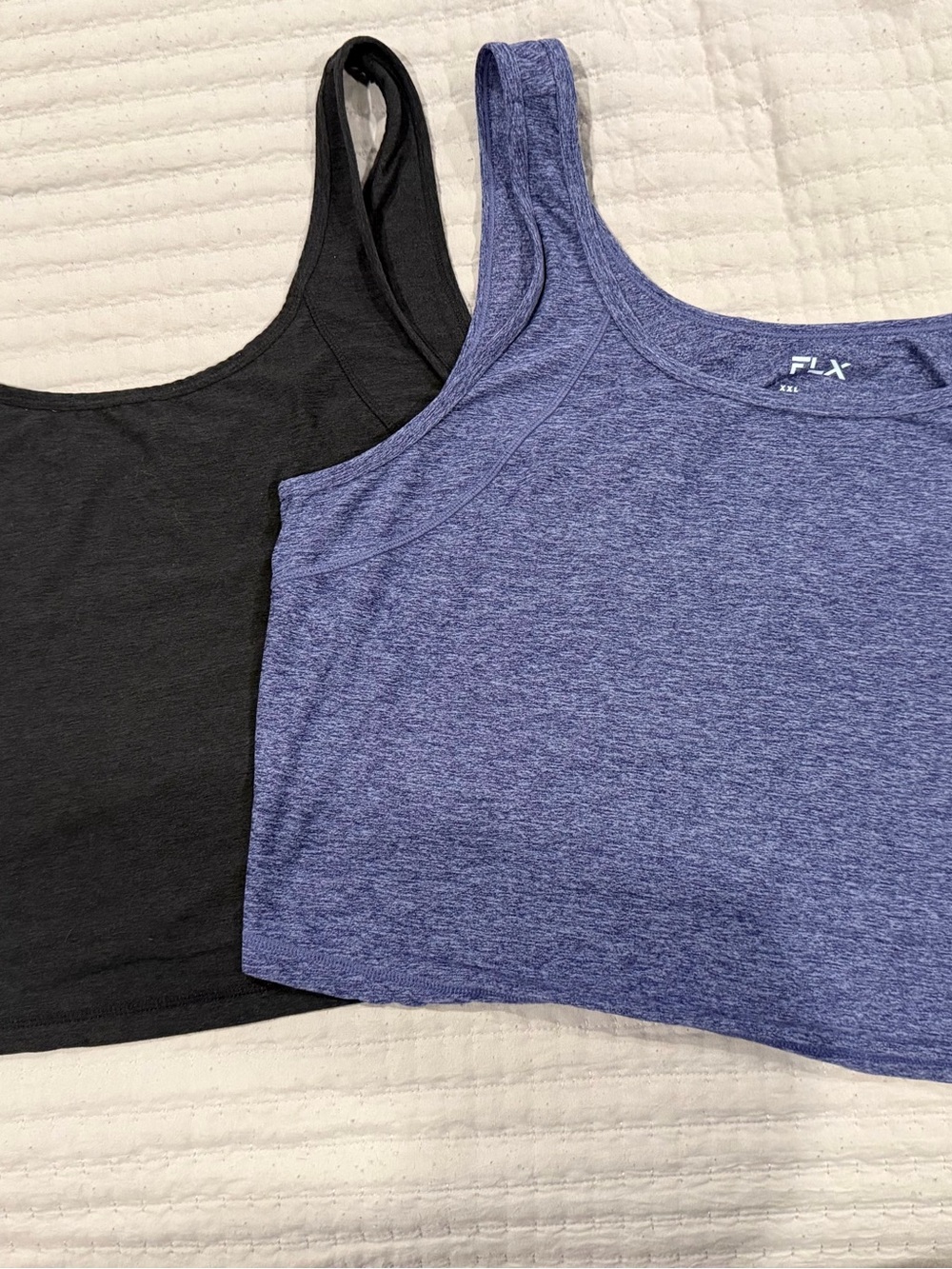 2 FLX Wander easy tank tops
— Blue Heather & Black